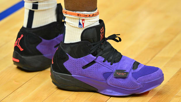View of Zion Williamson's purple and black Jordan Brand shoes.